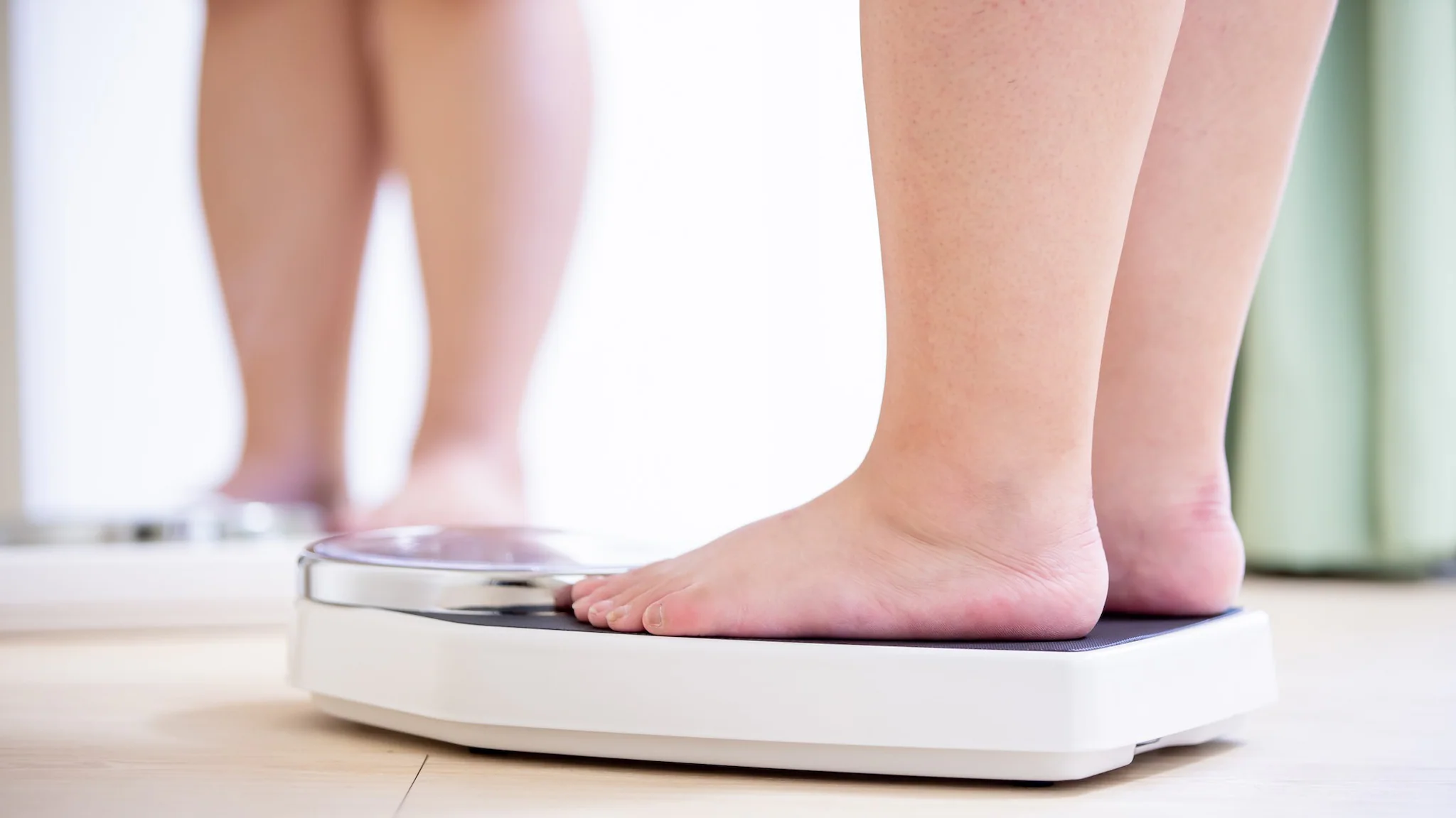 Child's feet on digital scales.