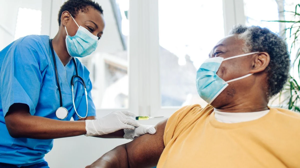 a doctor giving a flu shot