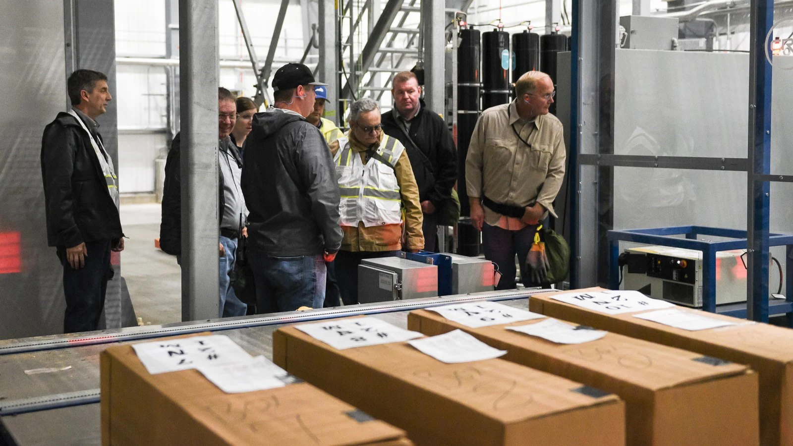 A group of inspectors in an industrial facility.