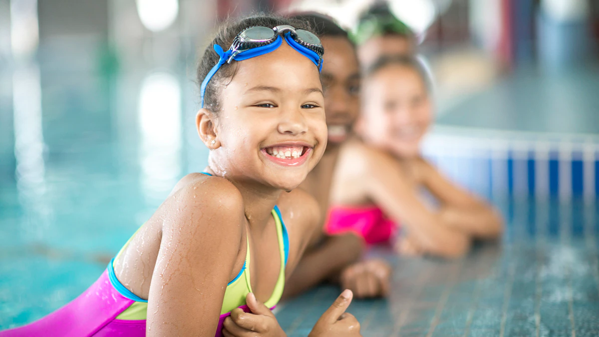 Young girl in swim lesson on pool edge