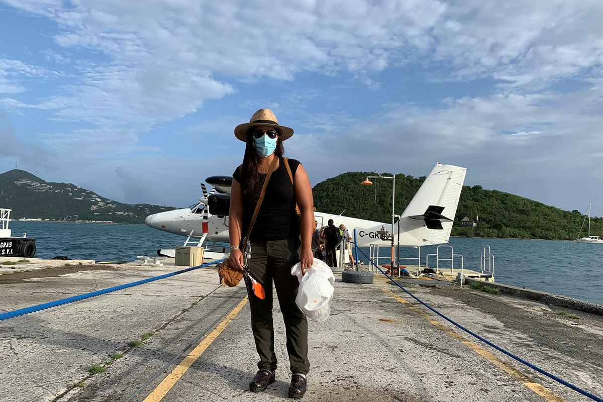 Valarie Mac standing in front of sea plane.