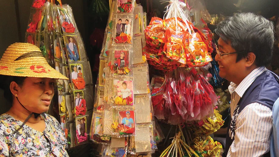 Two people in Burma market.