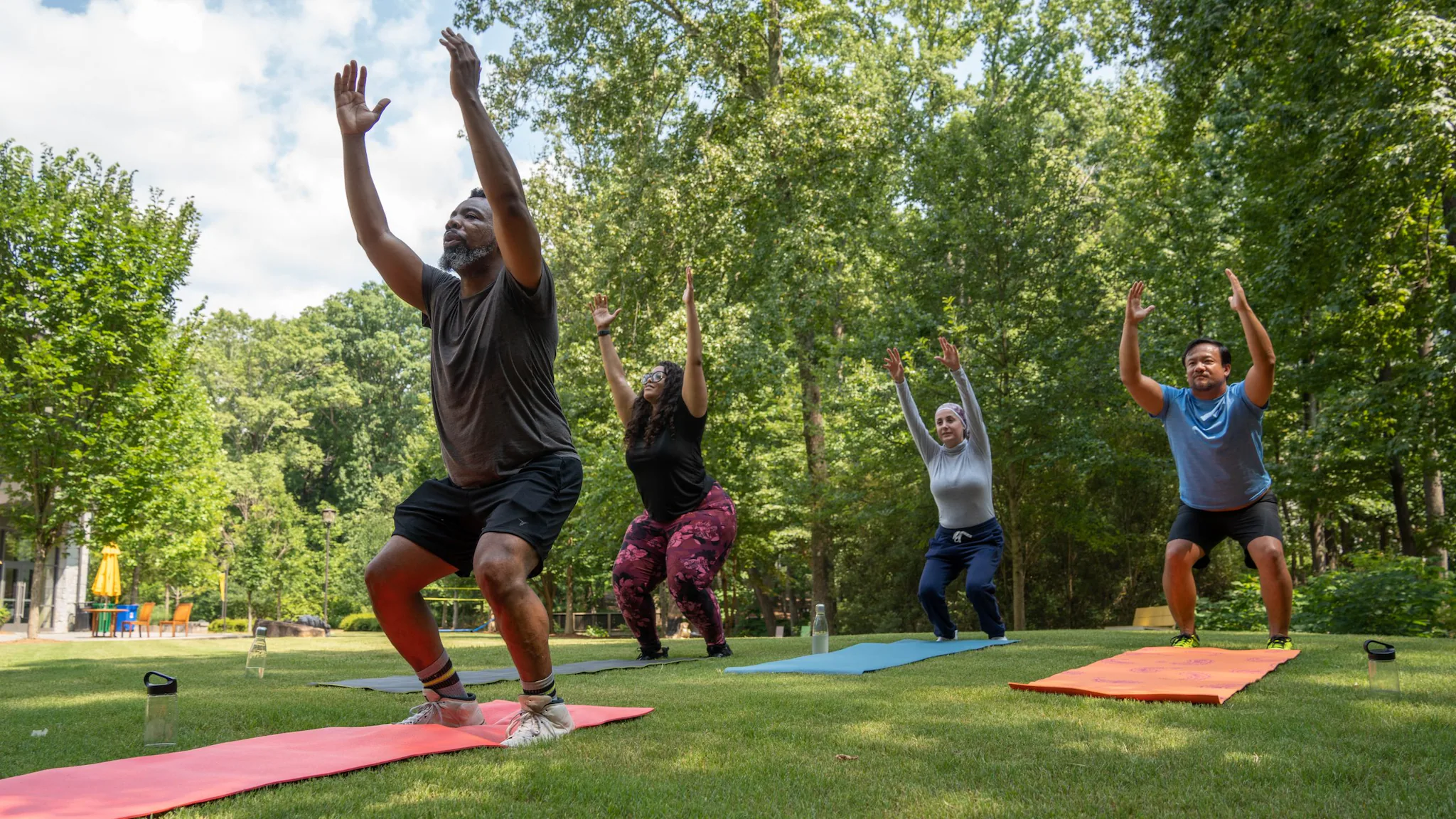 People doing yoga in the park