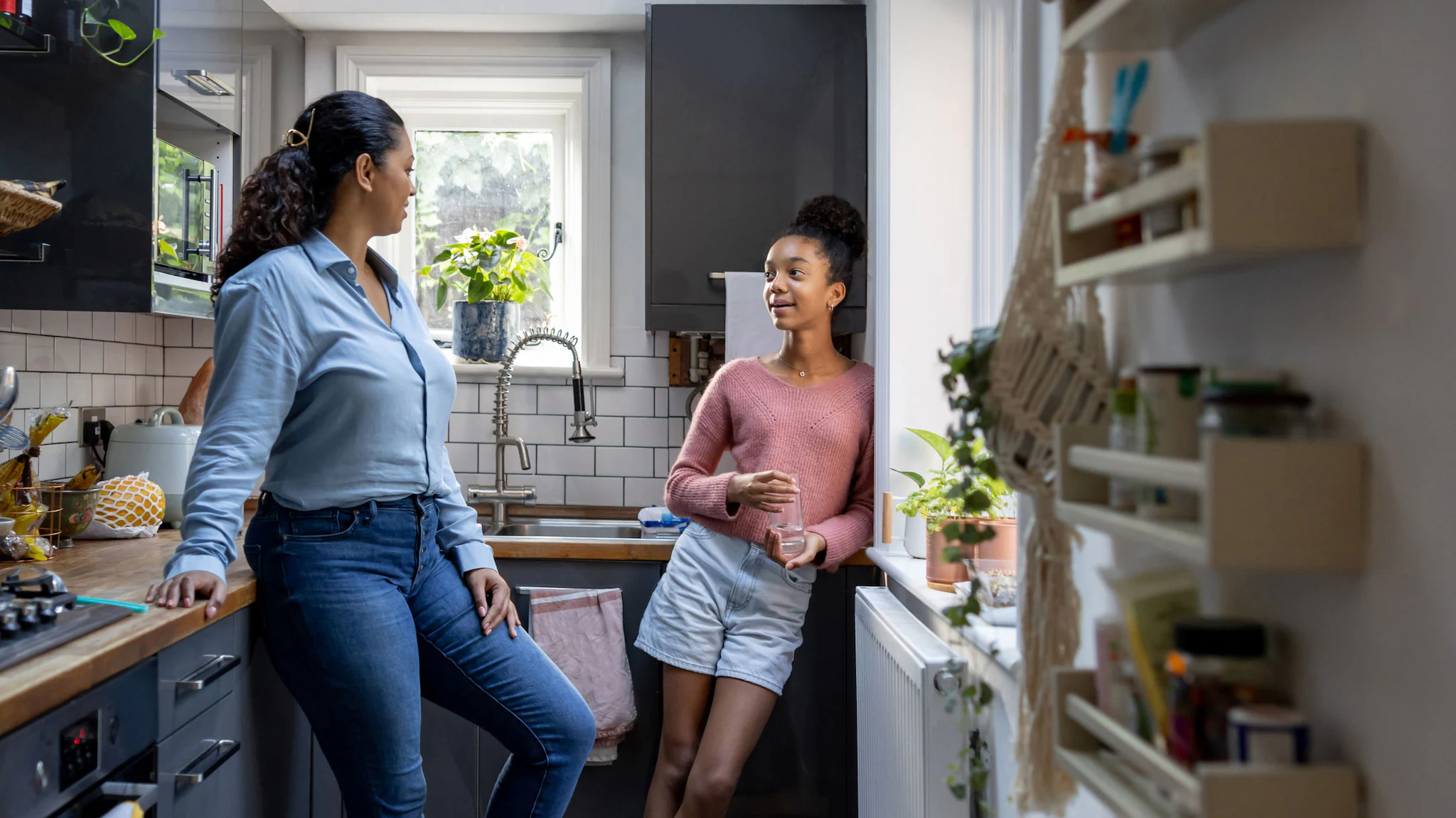 A mother talking to her teen daughter about birth control.