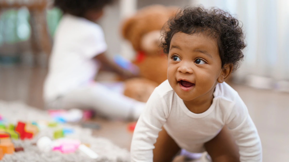 baby crawling and looking excited