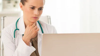 Doctor reading from a laptop