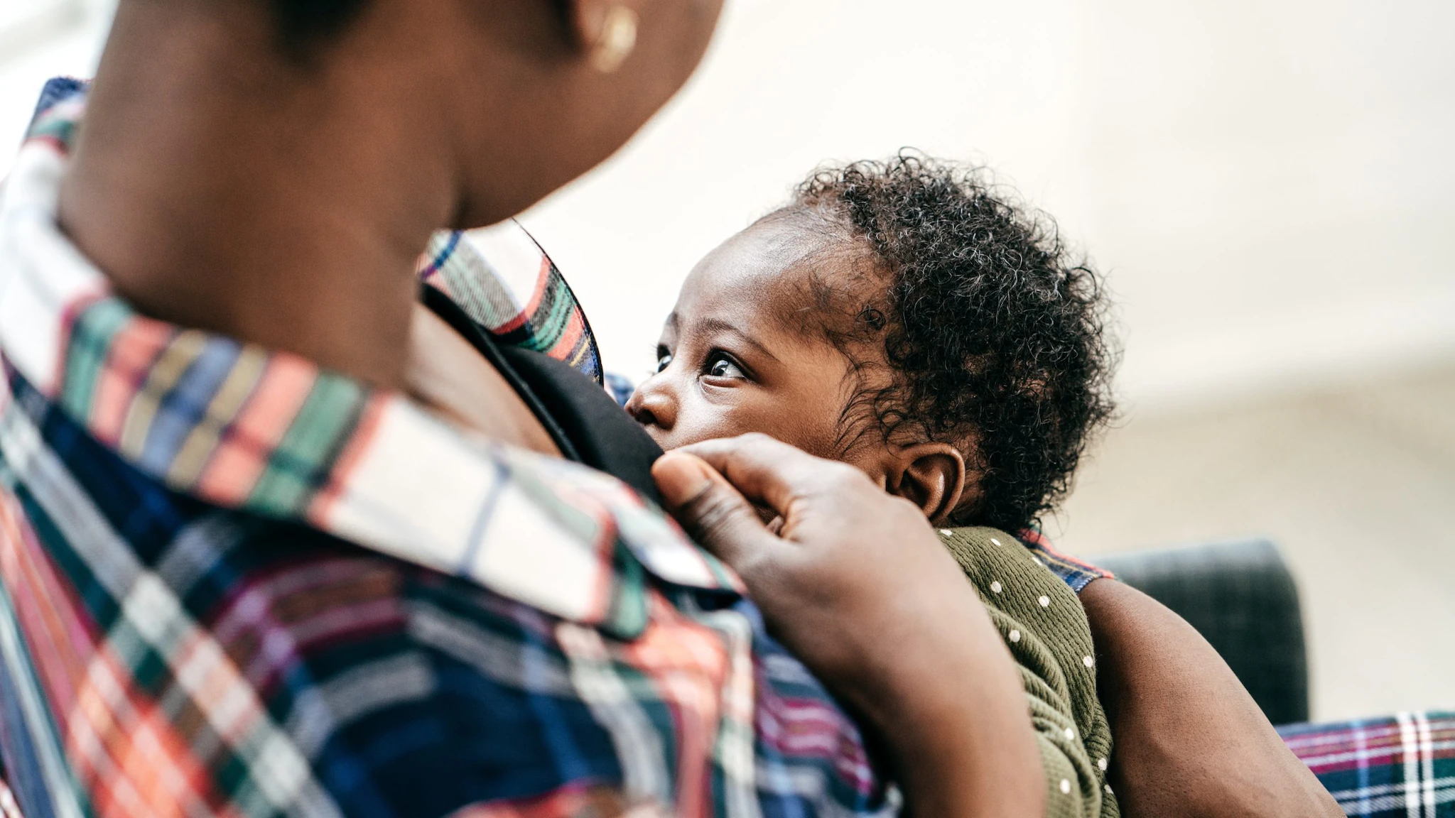 Mom breastfeeding her infant.