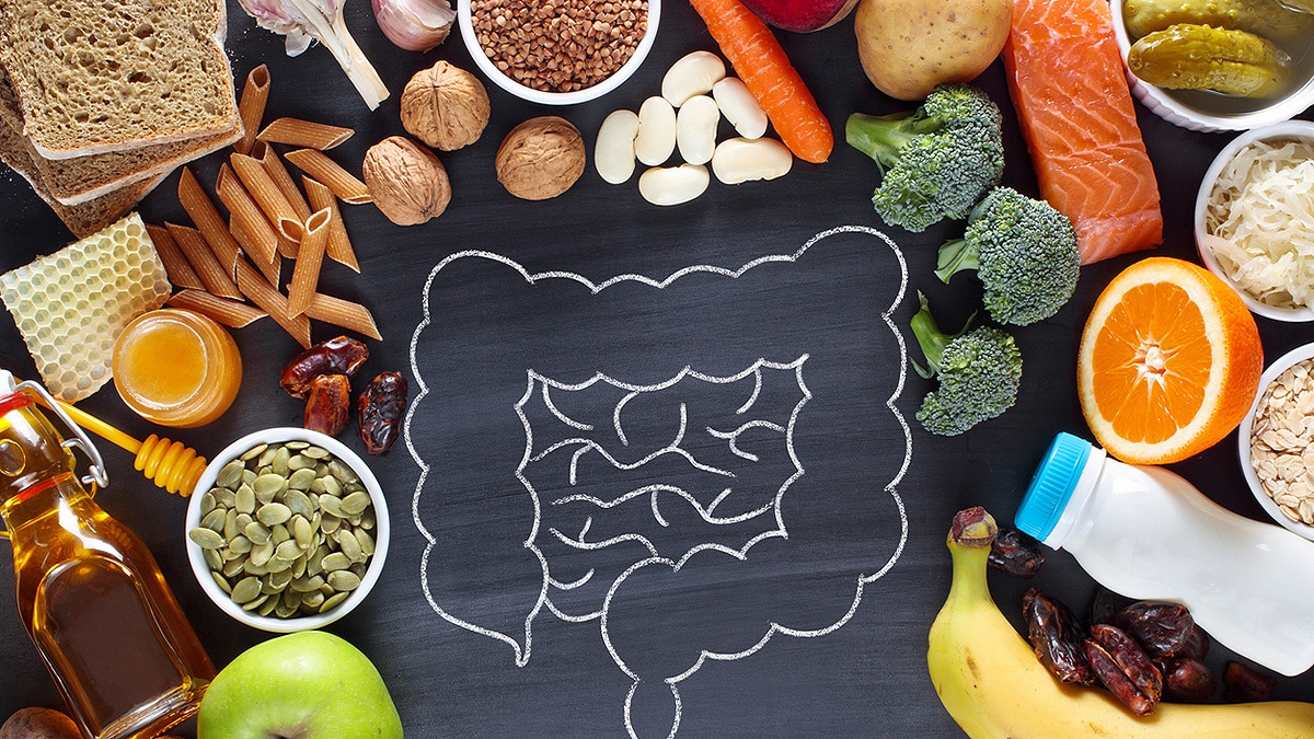 Healthy food surrounding chalk illustration of bowels.