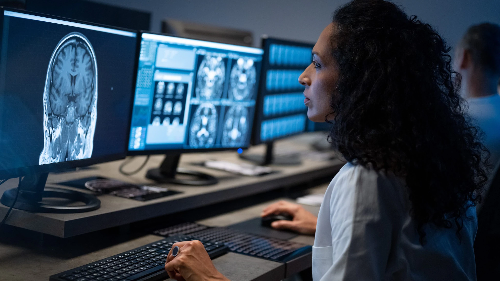 Doctor looking at a brain image on a computer