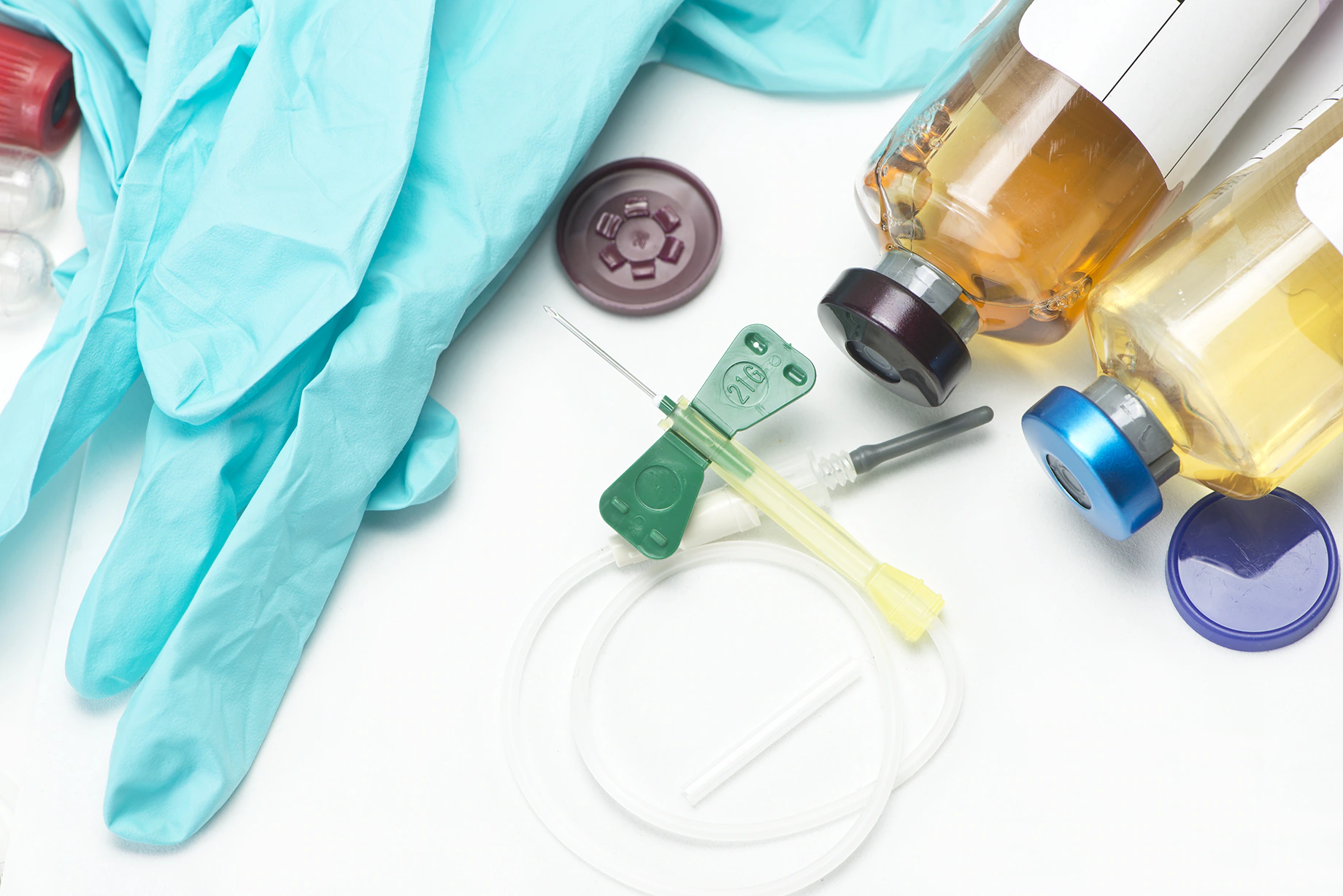 Example of some blood culture collection supplies including latex gloves, vials, and a needle