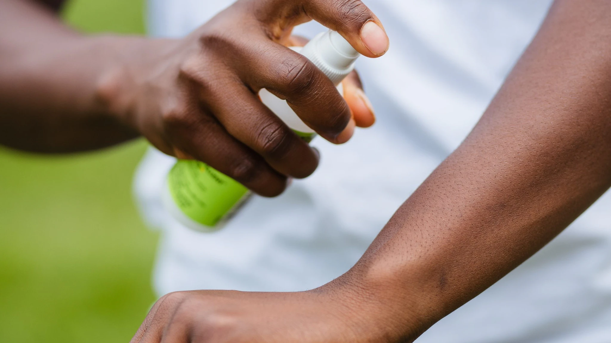 Person applying insect repellent