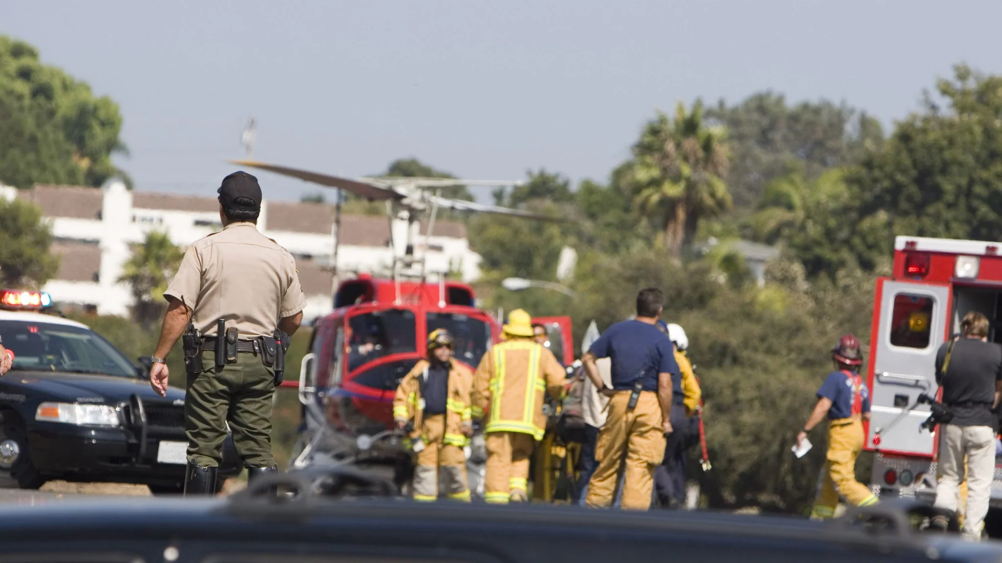 first responders including police officers and emergency medical services personnel at an emergency scene