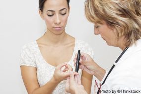 person getting a finger stick to test blood glucose level