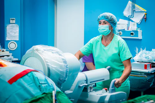 A healthcare professional working the fluoroscope machine.