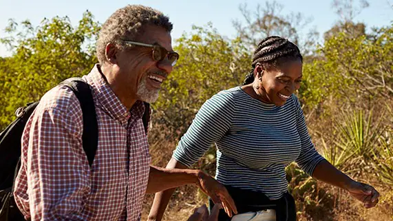 Two people hiking outside.