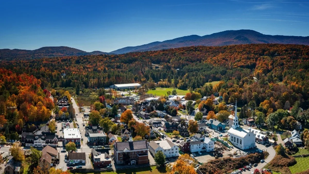 Picture of rural town with mountains in the background