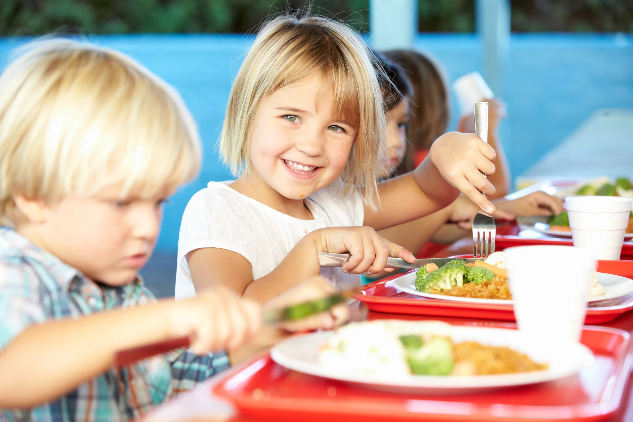 Happy students in a school cafeteria