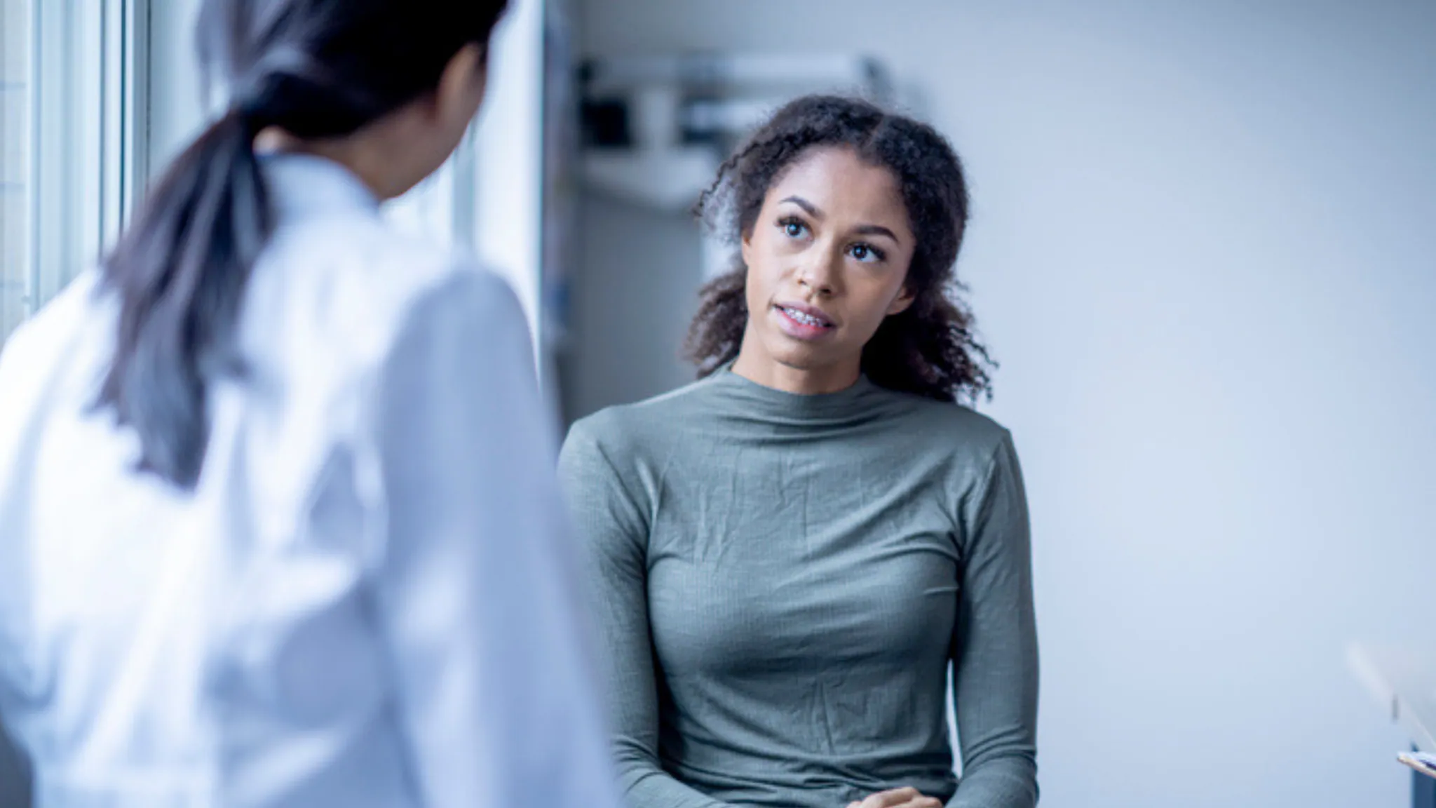 Healthcare provider speaking with patient