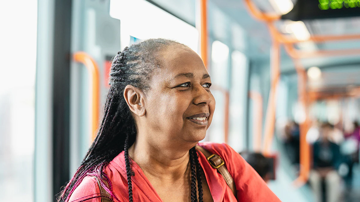 Senior woman traveling by bus.