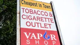 A sign for a Tobacco & Cigarette Outlet and Vapor Shop