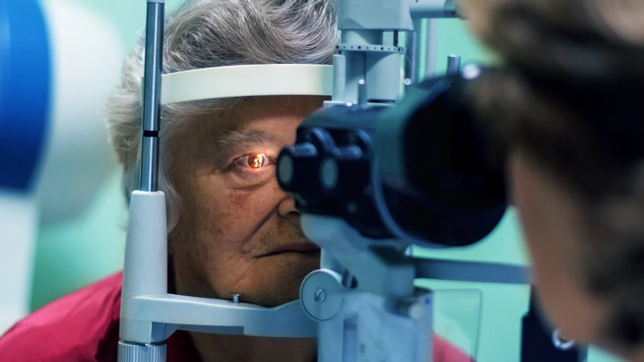 Older woman getting a retinal detachment exam