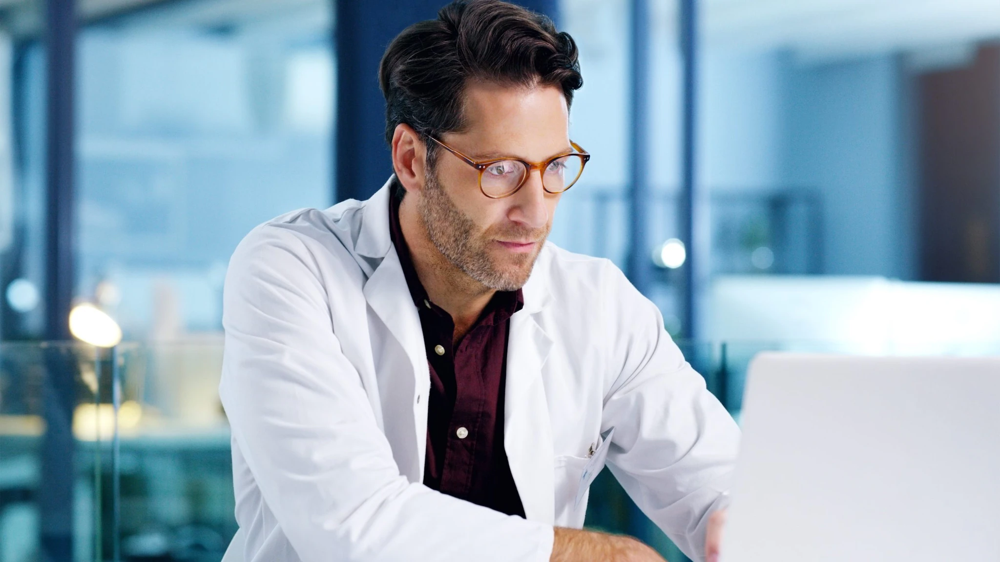 Doctor looking at computer